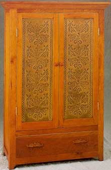 Large cherry armoire featuring Punched Tin Panel RP-1249 "Fleur Jardin".